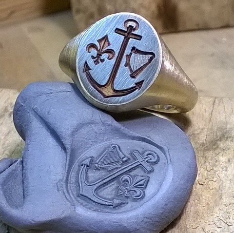 Impression from 2d crest engraved harp anchor ring